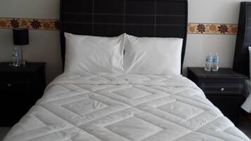 Suite familiar, varias camas, cocina | Edredón, wifi gratis y ropa de cama