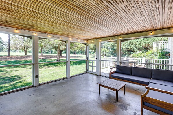 An open-air patio with a wooden ceiling, a sofa, and a table. - Richmond Vacation Rental ~ 10 Mi to Downtown! (Richmond)