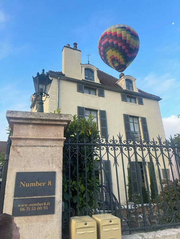 A building with a sign reading "Number 8" and a website address. - Luxurious A/C 5 bedroom Winemaker's 1870's house in heart of Meursault Burgundy (Meursault)