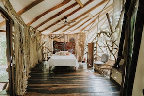 A room with a bed, a chair, and a ceiling fan. - El Sueño Riviera Maya (Tulum)