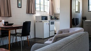 Family Room | Private kitchen | Electric kettle, toaster, cookware/dishes/utensils, dining table - Clyde Central Motel (Clyde)