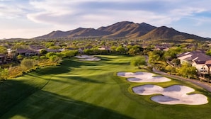 A golf course with sand bunkers, surrounded by residential houses and mountains in the background. - 🌵 Anthem Country Club Retreat.  Heated Saltwater Pool, Spa, Casita & Office. (New River)