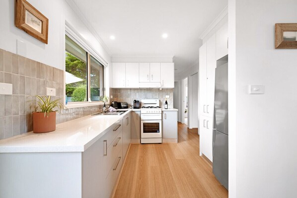 Fridge, microwave, stovetop, coffee/tea maker