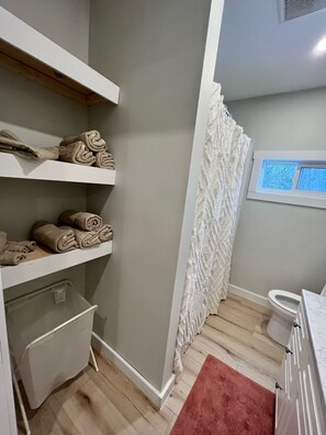 Hair dryer, towels, soap, toilet paper