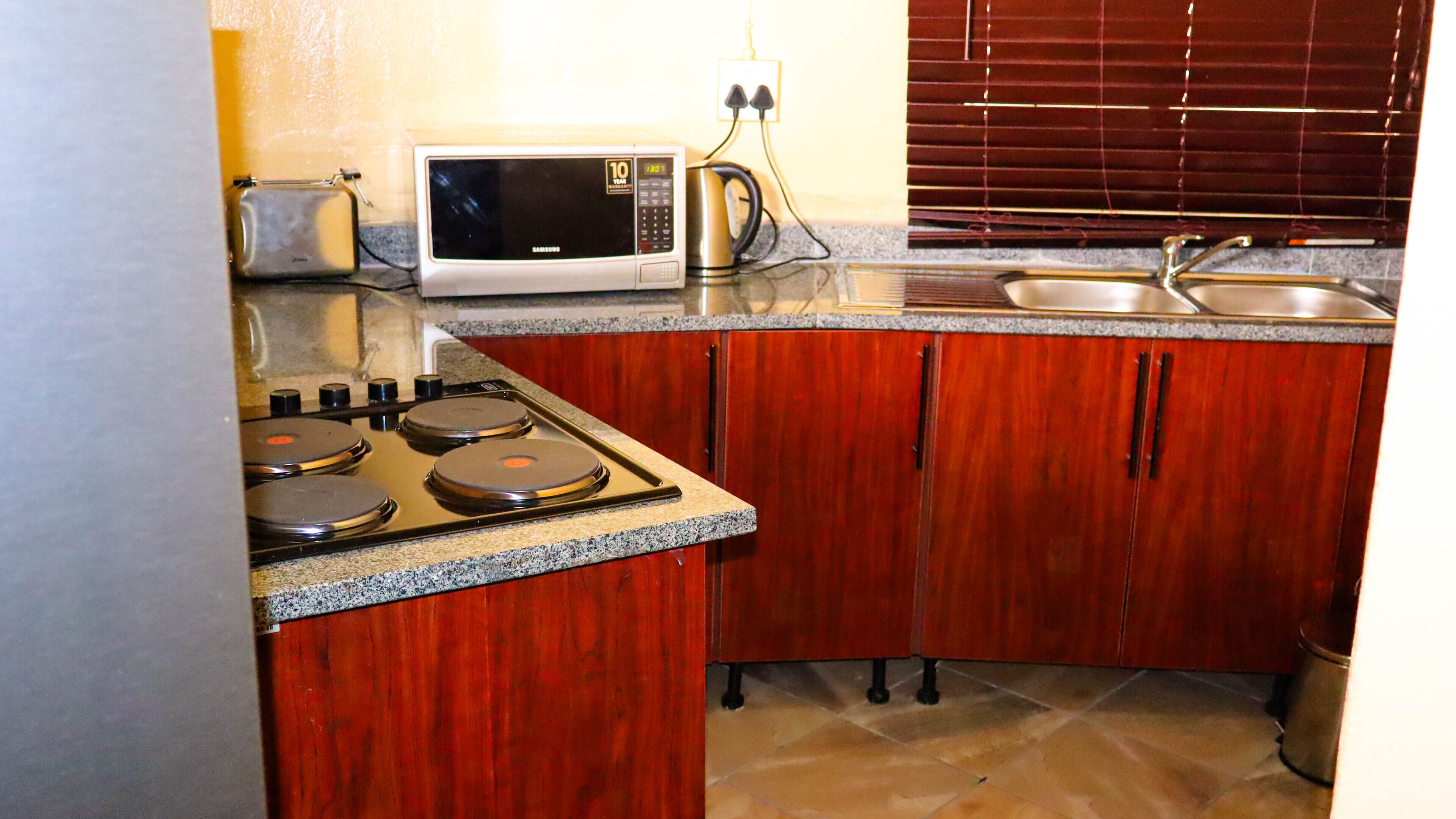 Family Chalet, 2 Bedrooms | Private kitchen | Fridge, microwave, oven, dishwasher
