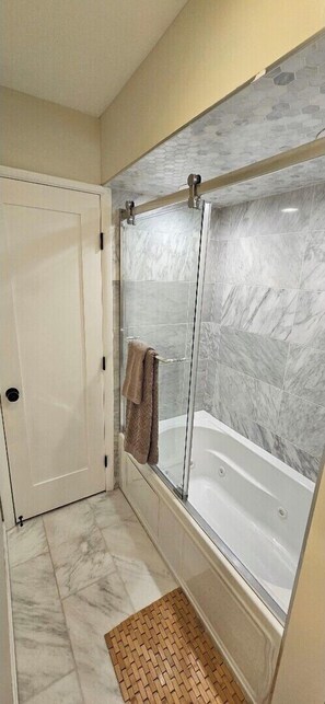Jetted tub, hair dryer, towels, soap