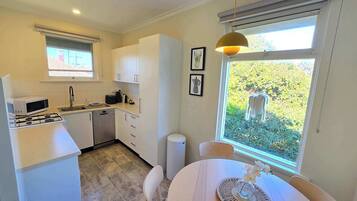 Coffee/tea maker, fridge, microwave, oven