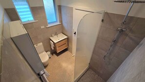 Shower, hair dryer, towels, toilet paper
