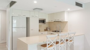 Fridge, microwave, oven, dishwasher - Eden Apartments Unit 101 Modern unit easy walk to beaches, clubs and shops, Wi-Fi Inc. (Coolangatta)