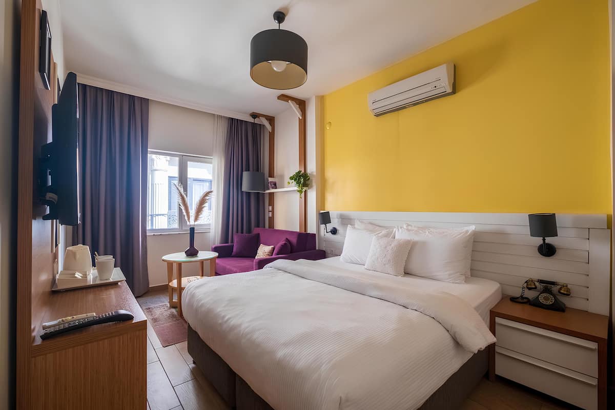 Premium bedding, laptop workspace, blackout curtains, soundproofing
