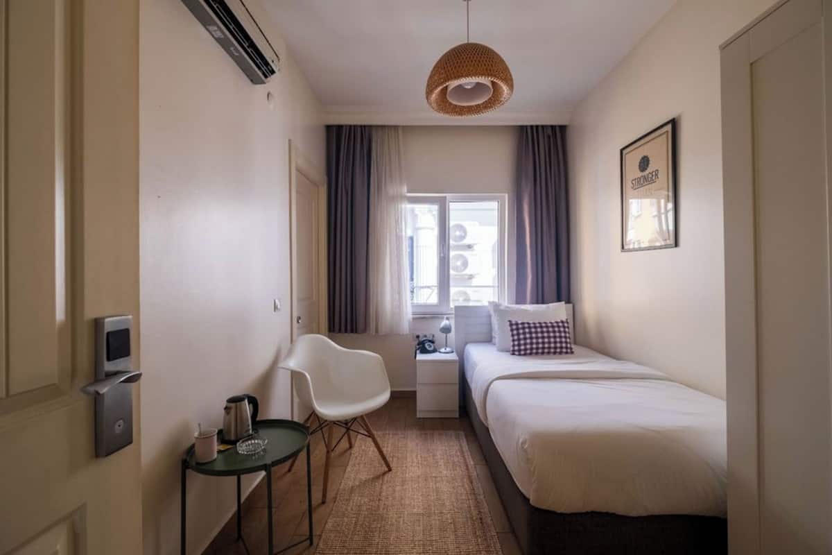 Premium bedding, laptop workspace, blackout curtains, soundproofing
