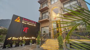 A building with a sign reading "A Unit Of Chopra's Bliss" and a restaurant sign "Amritara". - Amritara Maa Katra (Reasi)
