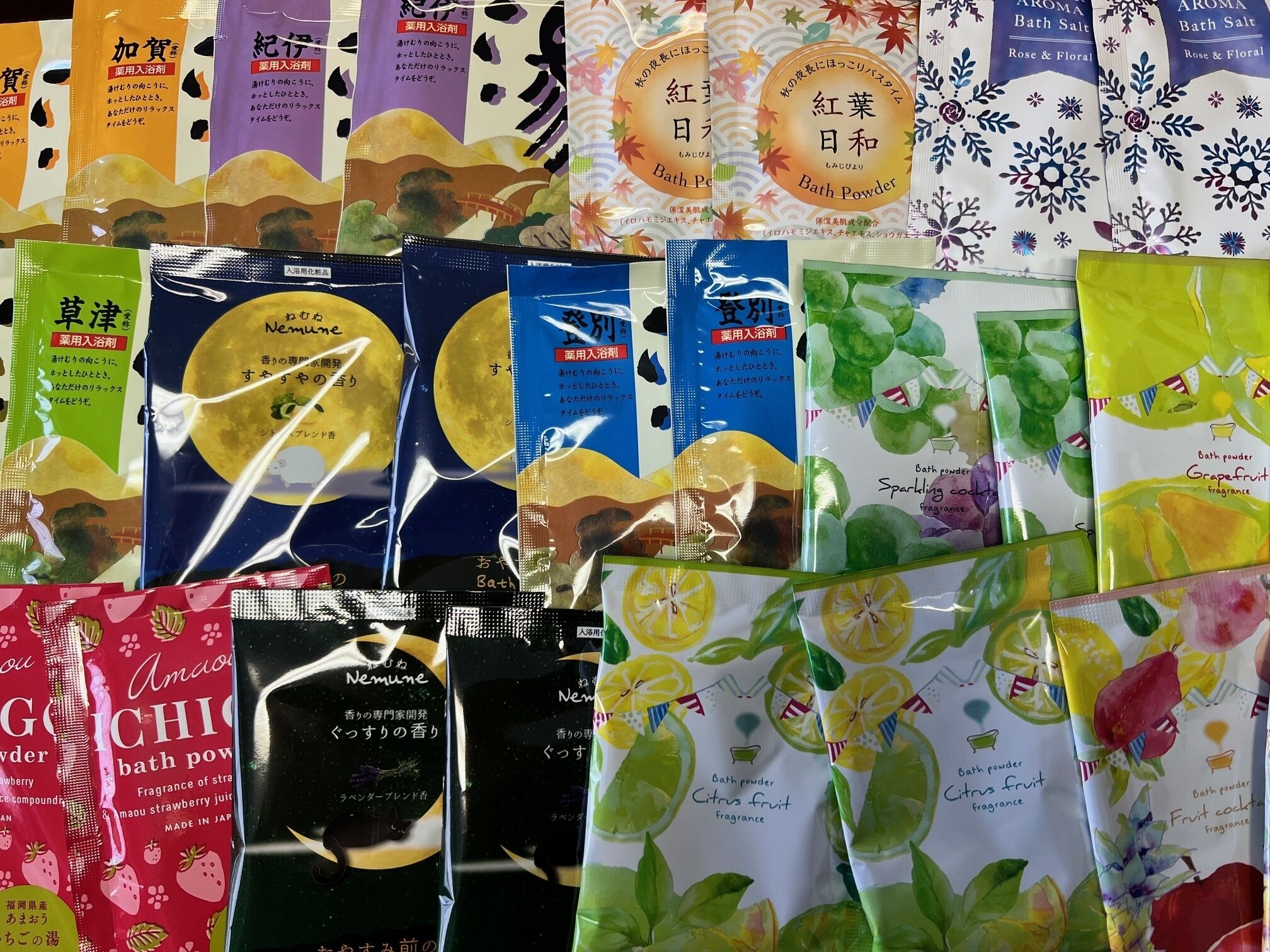 A variety of bath powders and fragrances displayed in multiple packages.