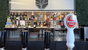 A bar area with a variety of liquor bottles and glasses. - Haus Kuckenberg (Burscheid)