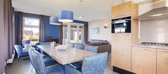 Holiday home with covered patio, sun shower and sauna