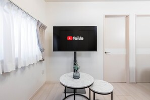 Stella Court 101, Non Smoking | Living area | Flat-screen TV