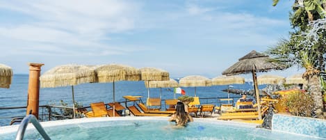 Seasonal outdoor pool, open 9:00 AM to 6:30 PM, pool umbrellas