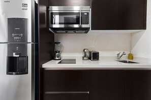Fridge, microwave, stovetop, coffee/tea maker
