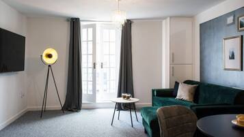 Comfort Apartment | Living area | 32-inch LED TV with cable channels