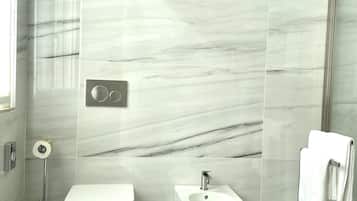 Deluxe Double Room, Garden View | Bathroom | Shower, rainfall showerhead, free toiletries, hair dryer