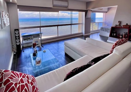 Apartment | Living area. Seafrontapartment-sleeps4-pool-parking-garden