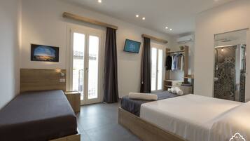 Chambre Triple Deluxe, vue ville | Draps en coton égyptien, literie de qualité supérieure