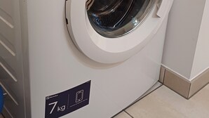 A white Electrolux TIMECAR E 500 1-7kg front-loading washing machine with a digital control panel and a 7kg capacity label. - In the Sweet Orchard of the Doubs ***** (Fertans)