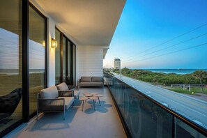 Terrace/patio - Ocean's Edge | Lavish NEW Condo w Beach Views, Cozy Decor & Fab Resort Amenities (Melbourne Beach)