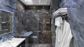 Deluxe Triple Room | Bathroom | Shower, hydromassage showerhead, designer toiletries, hair dryer