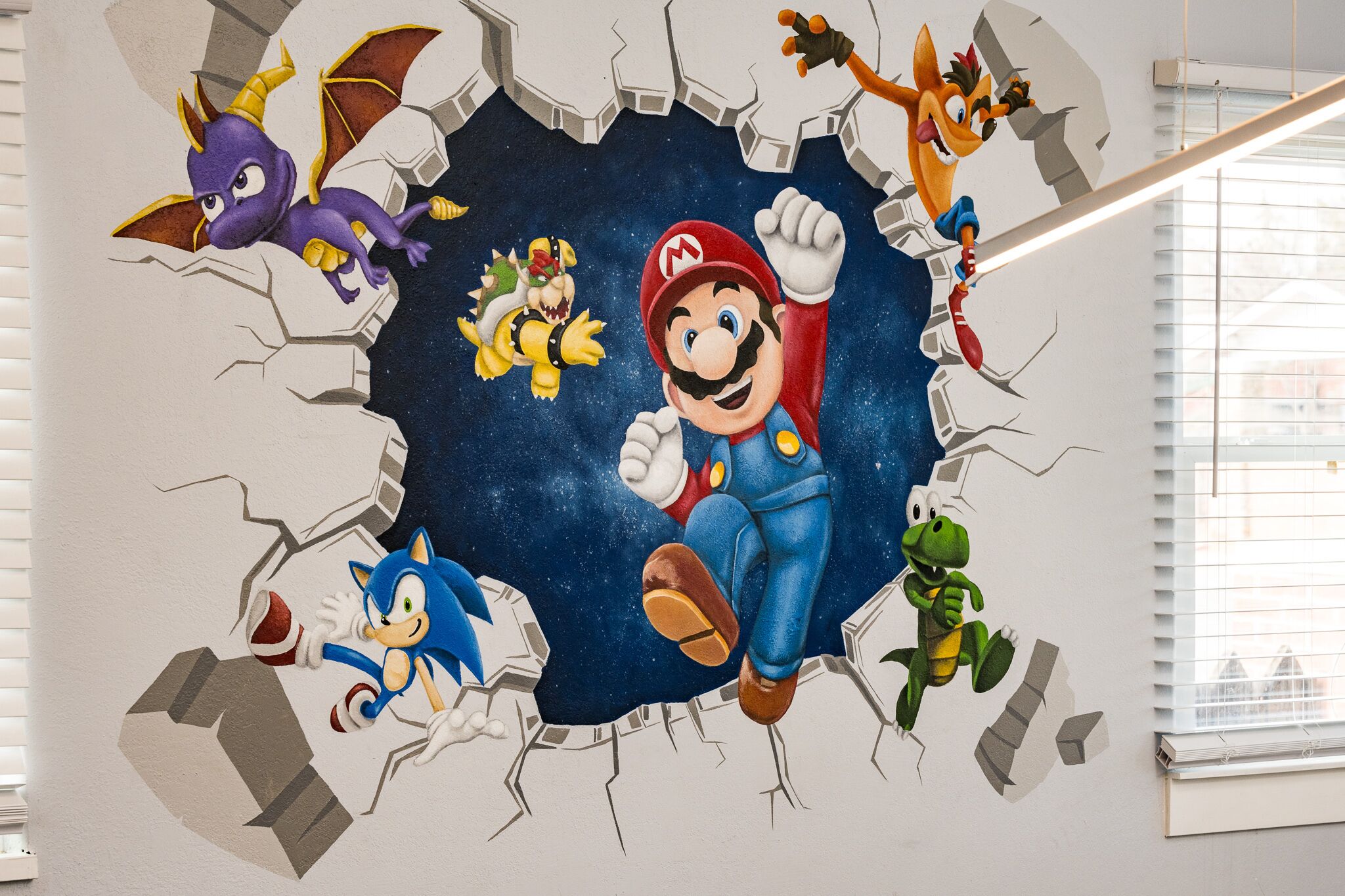 A wall mural featuring characters from the Mario series.