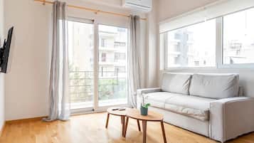 Apartamento luxo | Área de estar | TV LED 42 polegadas com canais a cabo