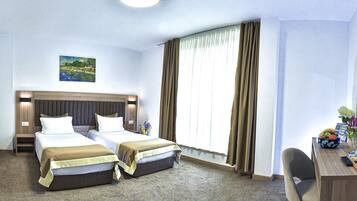 Deluxe Twin Room, City View | Premium bedding, minibar, in-room safe, desk