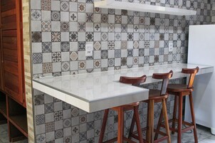 Fridge, oven, espresso maker, cookware/dishes/utensils