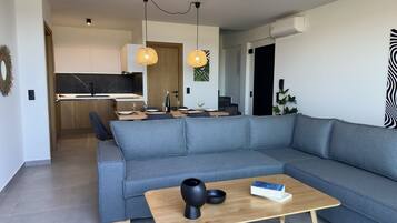 Deluxe Villa, Private Pool, Sea View | Living area | 55-inch Smart TV with digital channels