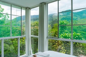 Laptop workspace, bed sheets