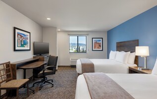 Premium bedding, pillowtop beds, desk, laptop workspace