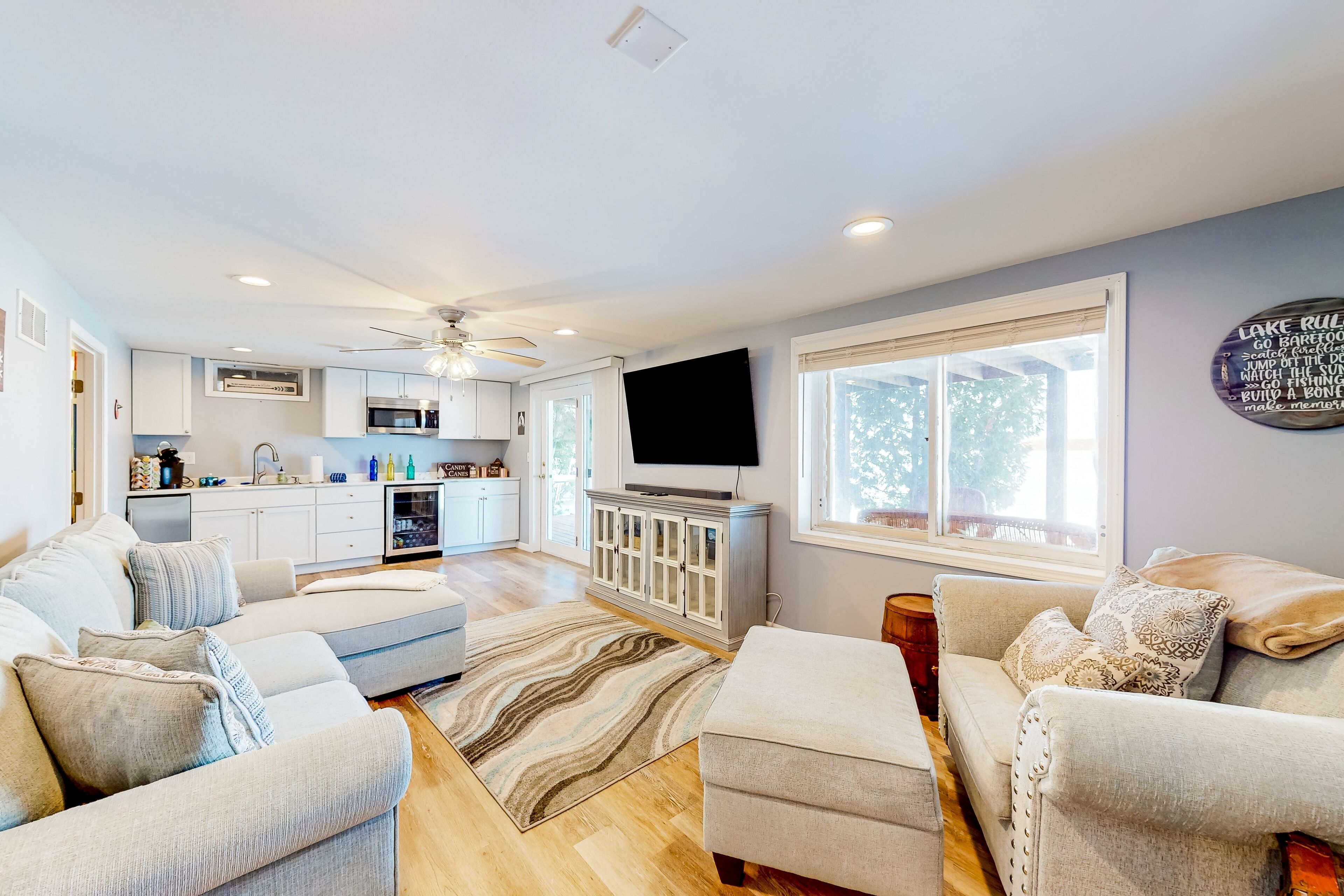 Serene lakefront retreat with wet bar, wraparound decks, dock, fireplaces, AC