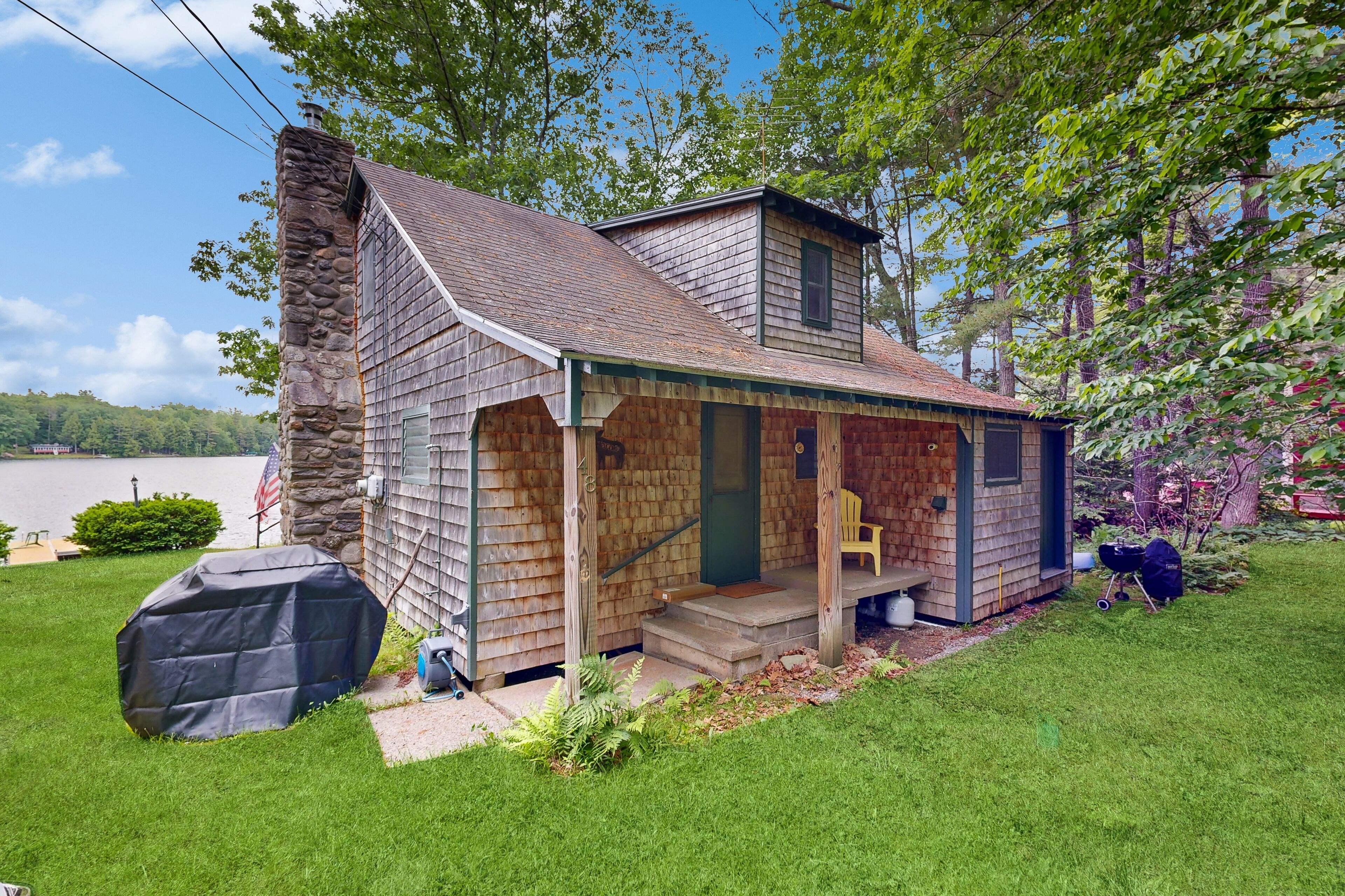 Rustic dog-friendly waterfront home with screened porch, dock, firepit, 2 kayaks