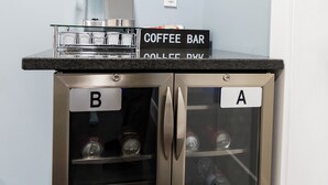 A coffee bar with two labeled compartments, B and A, containing beverages and a coffee machine.