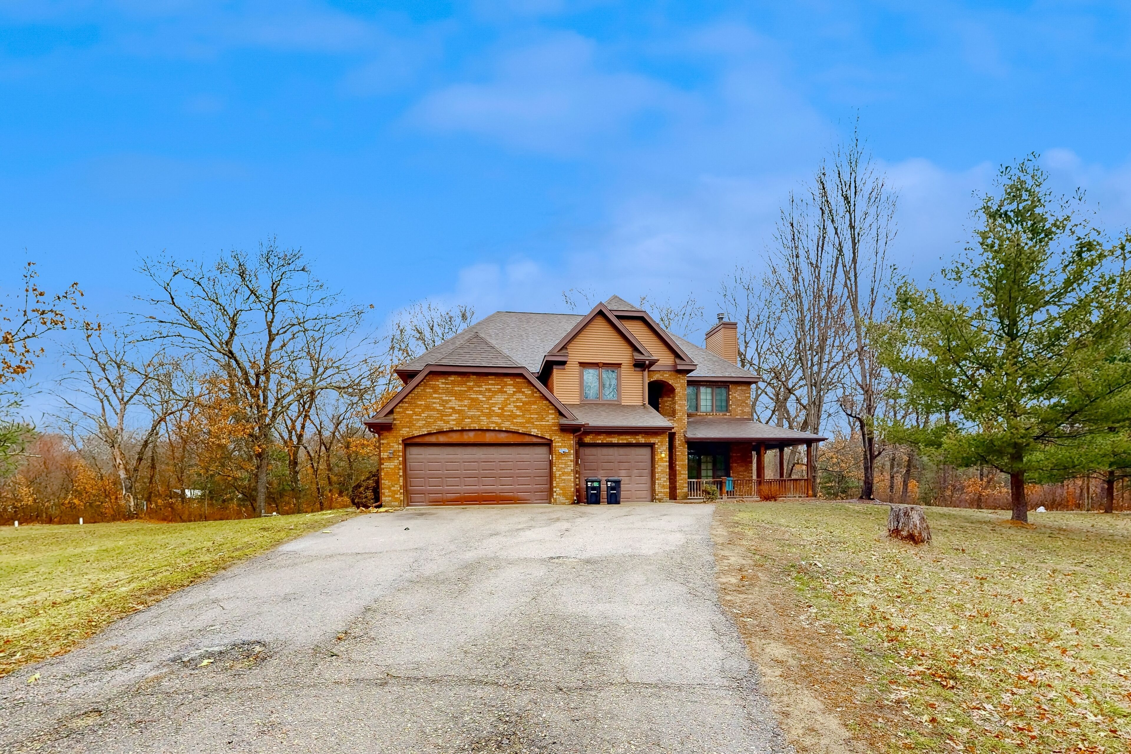 Secluded exclusive brick home with game room, fireplaces, large porch, firepit