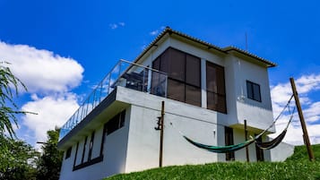 Enjoy a serene view from the spacious balcony overlooking the surrounding landscape.