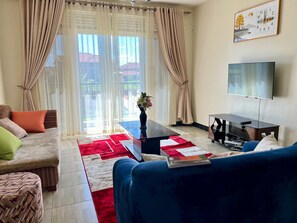 Smart TV, DVD player - Fully furnished 3-bedroom apartment in a serene and secure environment (Central Region)