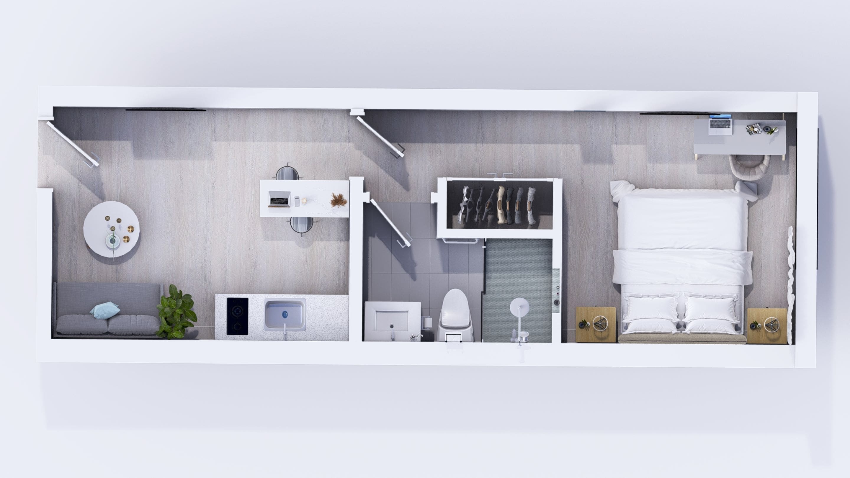 A modern hotel room layout with a bed, seating area, bathroom, and a small workspace.