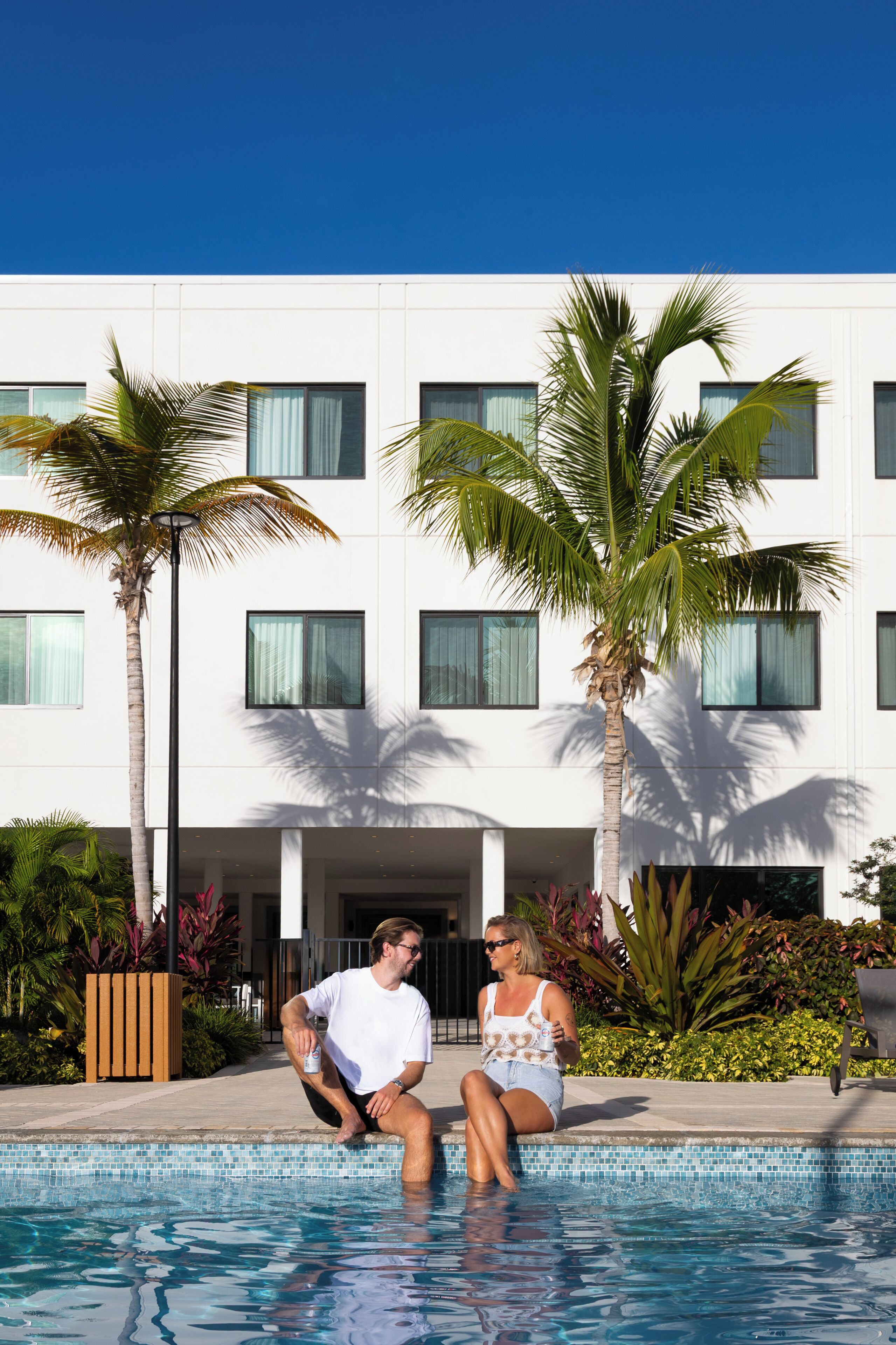 Outdoor pool, open 7:00 AM to 10:00 PM, pool umbrellas, sun loungers