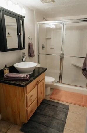 Shower, hair dryer, towels, soap