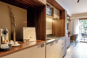 Standard Suite, 2 Twin Beds | Private kitchen | Full-size fridge, microwave, stovetop, cookware/dishes/utensils