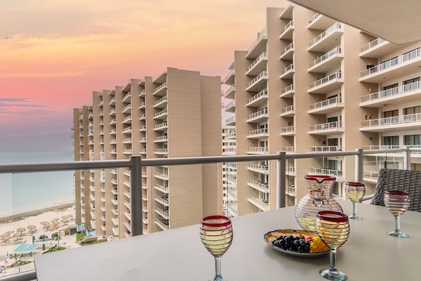 Sunsets are all yours on the sleek balcony.