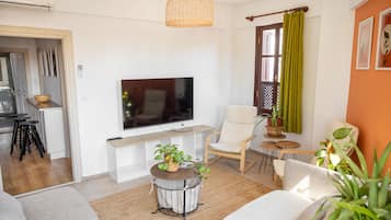 Deluxe Apartment | Living area | TV