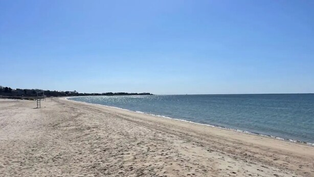 A beach with a clear sky, sandy shore, and calm sea. - Cape Cod Fun - Entire home 3BR up to 9 guests  (Barnstable)