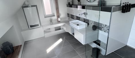 Shower, hair dryer, towels, soap